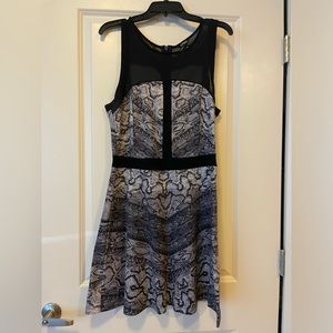 EUC size L snake skin print party peplum dress with mesh